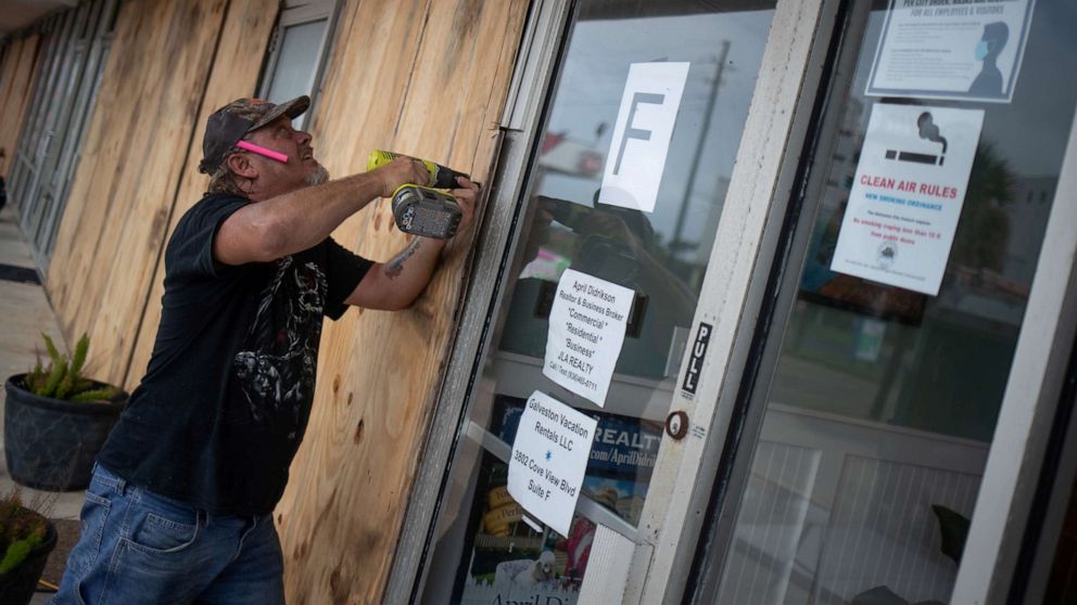 PHOTO: Local resident Robert Sawyer, 48, boards up businesses ahead of Hurricane Laura in Galveston, Texas, Aug. 26, 2020.