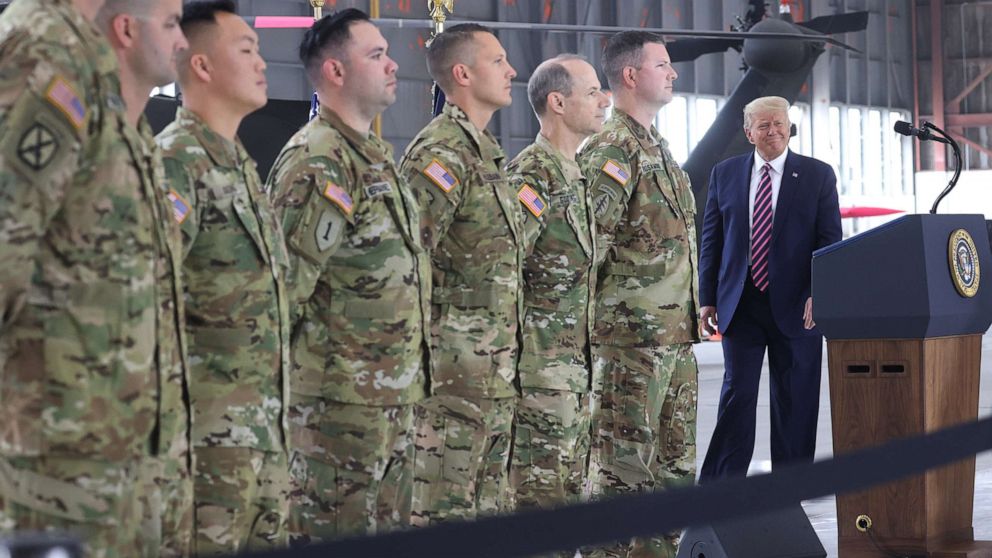 PHOTO: President Donald Trump takes to the podium during a ceremony to present the Distinguished Flying Cross to seven California National Guard helicopter crew members at McClellan Park, Calif., Sept. 14, 2020.