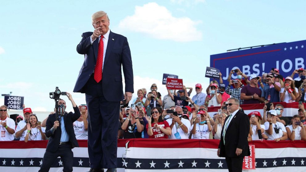 PHOTO: President Donald Trump gestures in front of supporters at Basler Flight Service in Oshkosh, Wis., Aug. 17, 2020.