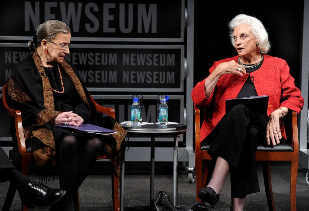 FILE PHOTO: The first female supreme court justice, Sandra Day O'Connor (R), speaks as fellow Justice Ruth Bader Ginsburg listens during a forum at the Newseum, in Washington, April 11, 2012.
