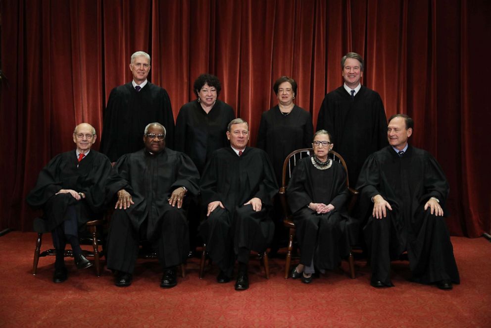 PHOTO: Associate Justice Ruth Bader Ginsburg sits with her colleagues on the United States Supreme Court during a group portrait after Associate Justice Brett Kavanaugh joined the court on Nov. 30, 2018, in Washington.