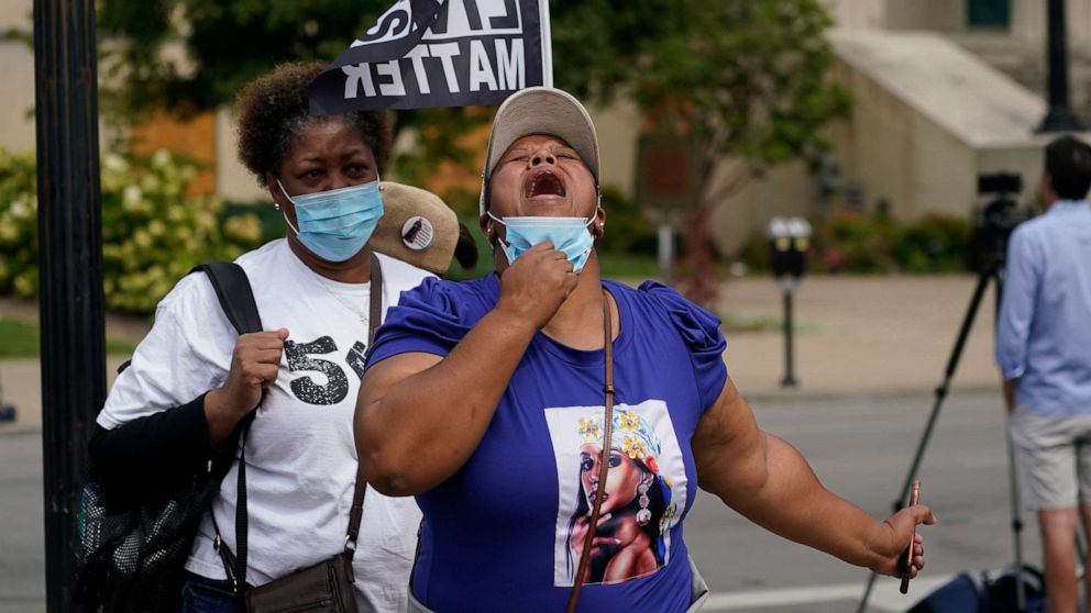 PHOTO: A woman reacts to news in the Breonna Taylor shooting, Sept. 23, 2020, in Louisville, Ky.