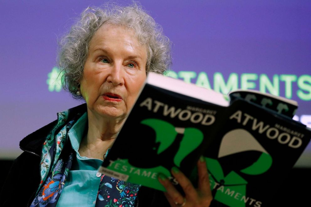 PHOTO: Canadian author Margaret Atwood holds a copy of her book 