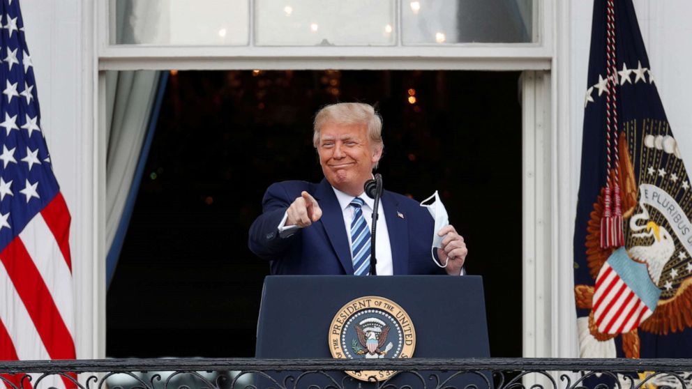 PHOTO: President Donald Trump gestures as he stands on a White House balcony speaking to supporters gathered on the South Lawn for a campaign rally that the White House is calling a 