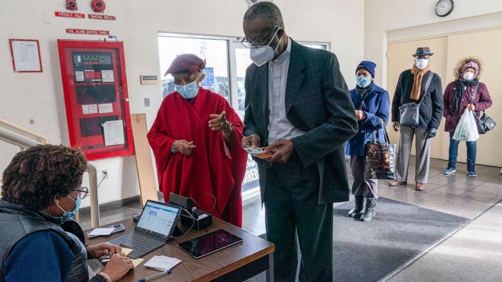 PHOTO: A medical worker registers Rev. Dr. Alfred Cockfield and Linette Cockfield for their first dose of the coronavirus vaccine at a pop-up COVID-19 vaccination site at the church, Feb. 3, 2021, in the Brooklyn borough of New York.