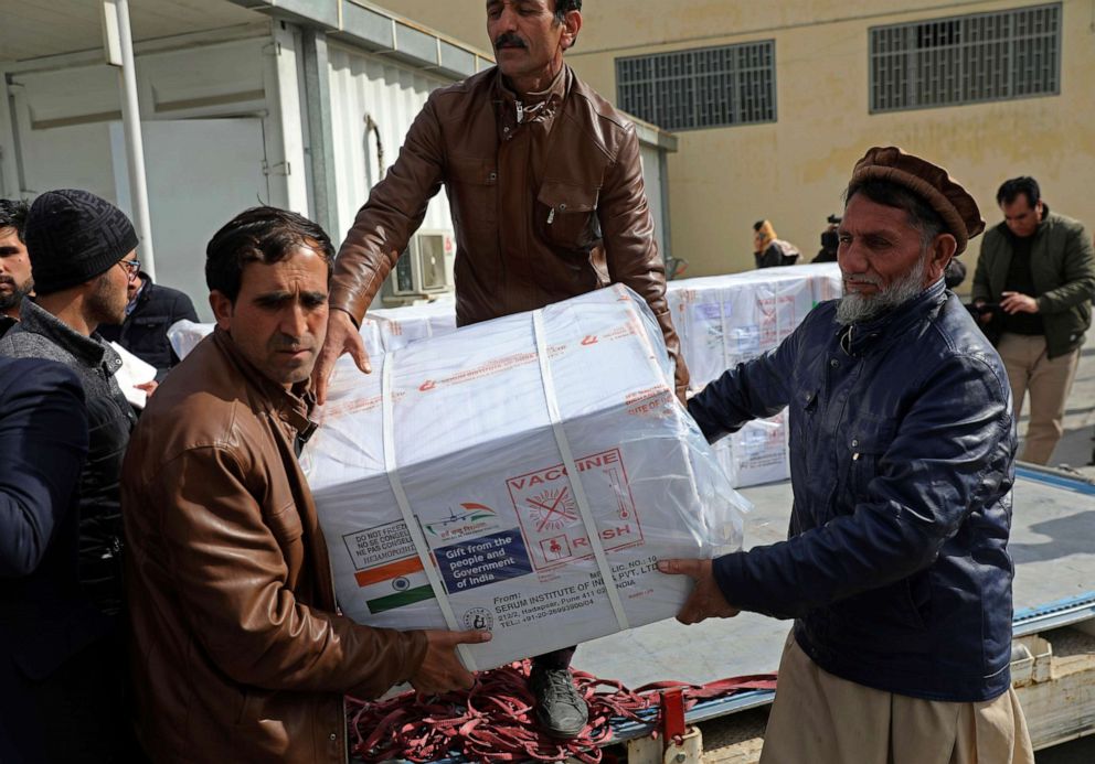 PHOTO: Afghan health ministry workers unload boxes of the AstraZeneca coronavirus vaccine donated by the Indian government to Afghanistan, at the customs area of the Hamid Karzai International Airport, in Kabul, Afghanistan.