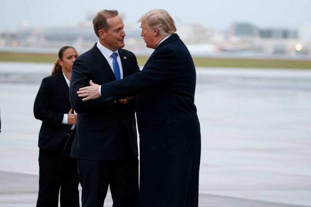 PHOTO: President Donald Trump shakes hands with Rep. Ted Budd, R-N.C., after arriving at Charlotte Douglas International Airport for a campaign rally, Friday, Oct. 26, 2018, in Charlotte, N.C.