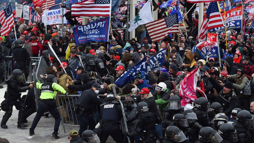PHOTO: (FILES) In this file photo taken on January 06, 2021 Trump supporters clash with police and security forces as they push barricades to storm the US Capitol in Washington D.C. 