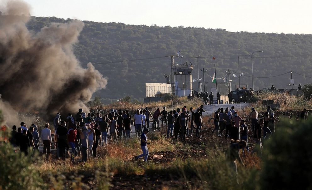 PHOTO: Palestinian protesters clash with Israeli soldiers in the West Bank city of Jenin, on May 18, 2021.