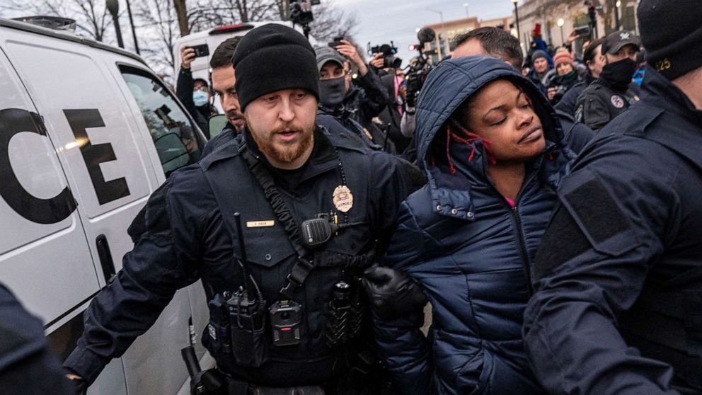 PHOTO: Kenosha Police arrest a protester who is in favor of conviction in front of the Kenosha County Courthouse while the jury deliberates the Kyle Rittenhouse trial in Kenosha, Wis., Nov. 17, 2021.