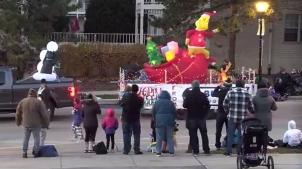 PHOTO: People watch a Christmas parade in Waukesha, Wisc., on Nov. 21, 2021, shortly before an incident where a car drove into the parade, injuring more than 20, according to police.