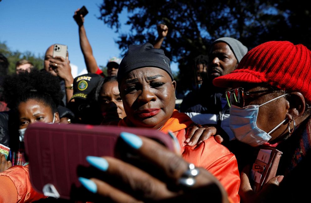 PHOTO: People react outside the Glynn County Courthouse after the jury reached a guilty verdict in the trial of William 