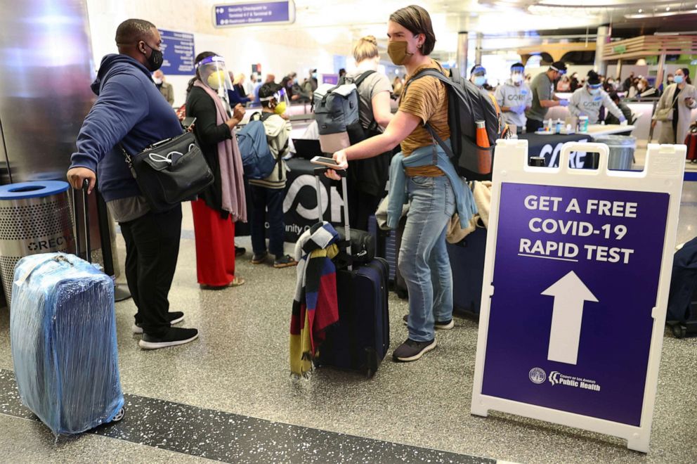 PHOTO: People who arrived on international flights wait to be tested on the first day of a new rapid COVID-19 testing site for arriving international passengers at Los Angeles International Airport (LAX) on Dec. 3, 2021, in Los Angeles.