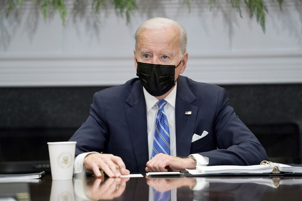 PHOTO: President Joe Biden wears a Covid-19 protective mask while attending a meeting at the White House in Washington, Dec. 16, 2021.