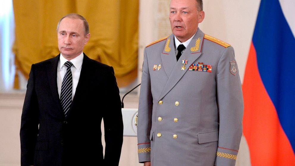 In this photo taken on March 17, 2016, Russian President Vladimir Putin, left, poses with Col. Gen. Alexander Dvornikov during an awarding ceremony in Moscow's Kremlin, Russia. Russia has appointed a new Ukraine war commander. A top U.S. official on 