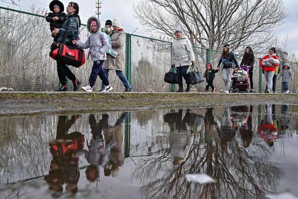 PHOTO: People cross from Ukraine into Poland at the border crossing between Shehyni and Medyka as they flee from the Russian invasion on April 3, 2022.