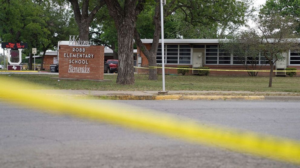 PHOTO: Sheriff crime scene tape is seen outside of Robb Elementary School as State troopers guard the area in Uvalde, Texas, on May 24, 2022.