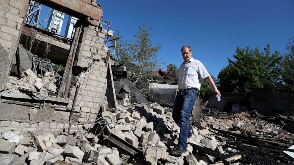 PHOTO: A man walks among rubbles of a house following a last night military strike, amid Russia's attack on Ukraine, at a residential area in Kharkiv, Ukraine, June 7, 2022. 