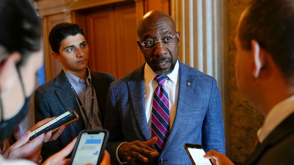 PHOTO: Sen. Raphael Warnock speaks with reporters on Capitol Hill in Washington, Aug. 6, 2022.