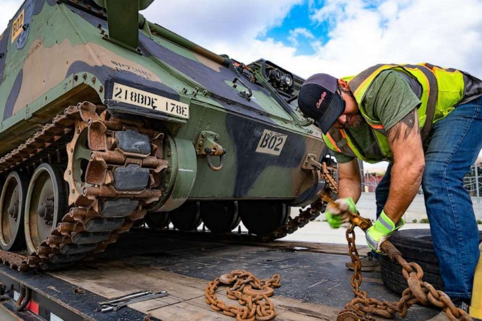 PHOTO: A civilian truck driver secures an M113 Armored Personnel Carrier to a flatbed trailer at Stones Ranch Military Reservation, East Lyme, Conn., April 27, 2022.