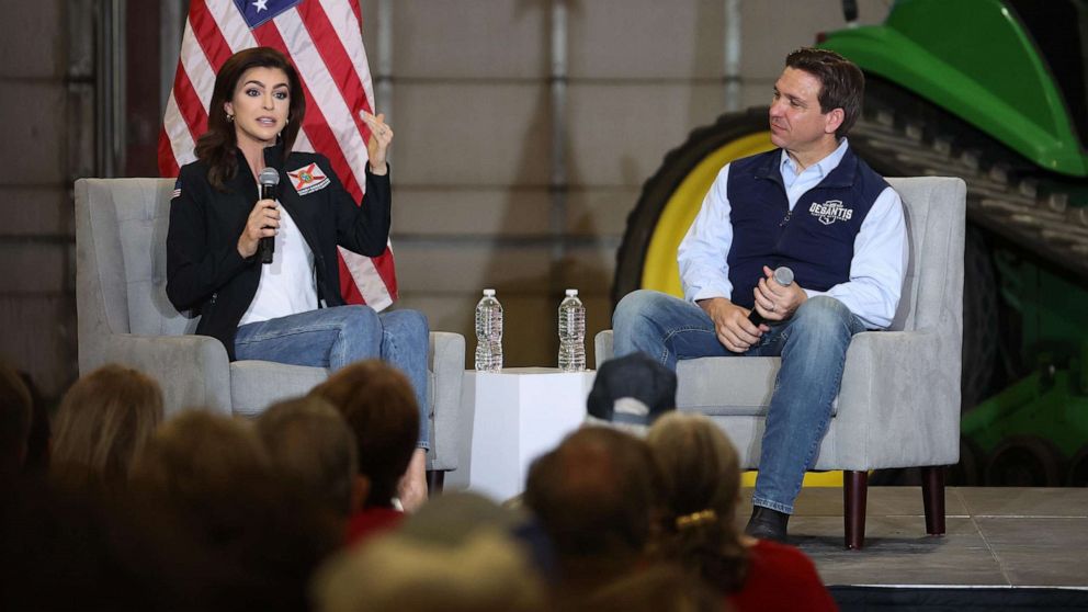 PHOTO: Republican presidential candidate Florida Governor Ron DeSantis listens a his wife Casey speaks during a campaign rally at Port Neal Welding Company, on May 31, 2023, in Salix, Iowa.
